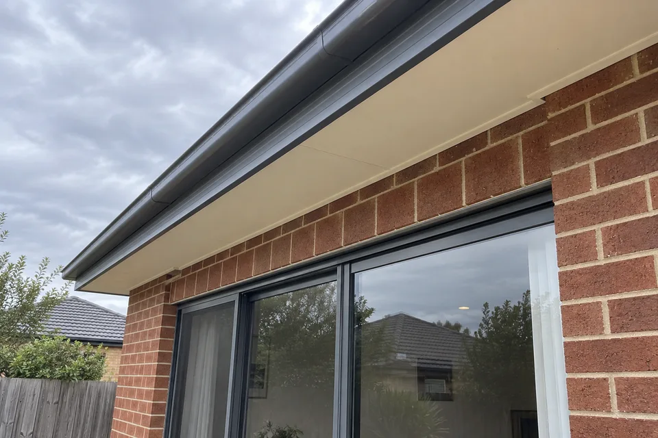 AI example: show the gutter, eaves and top of the sliding doors from ground level