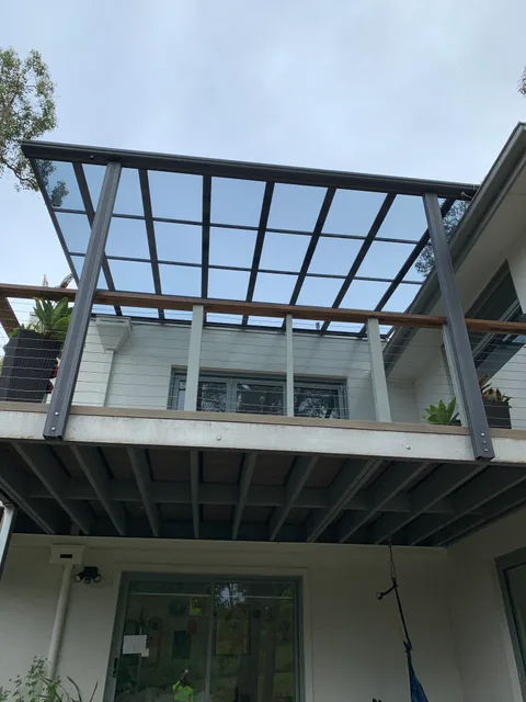 Clearview installation: Roof above an upper-level outdoor area