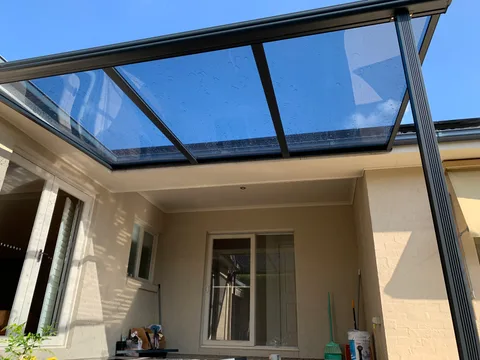 Clearview installation: An open-sided roof beside sliding doors