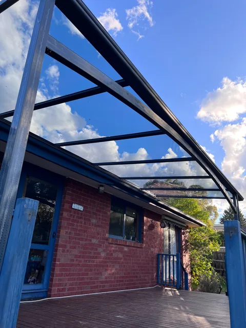 Clearview installation: Roof framing alongside a brick wall