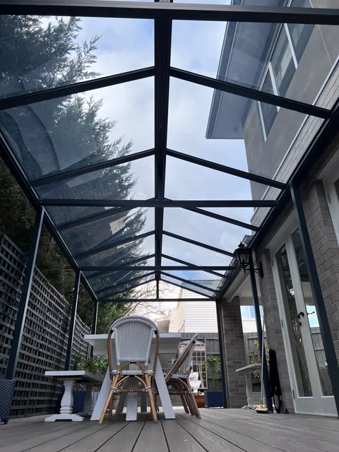 Clearview installation: Outdoor dining beneath a pitched roof