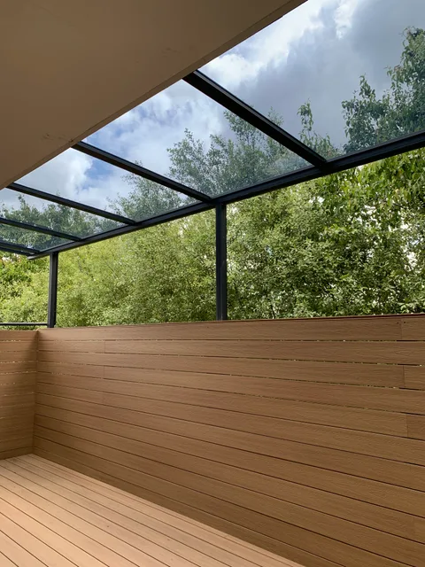 Clearview installation: A sheltered deck beside a privacy screen