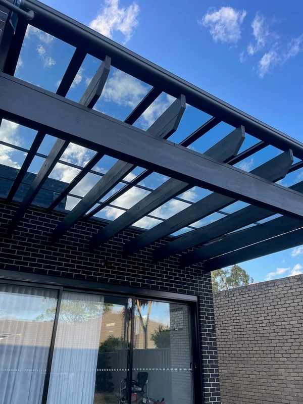 The same timber pergola with transparent Clearview roofing added